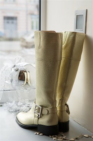 Female boots on a show-window of shoe shop Stock Photo - Budget Royalty-Free & Subscription, Code: 400-05060437