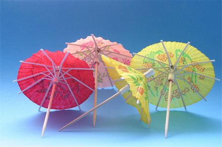 ricepaper - cocktail umbrellas on blue Stock Photo - Budget Royalty-Free & Subscription, Code: 400-05060477