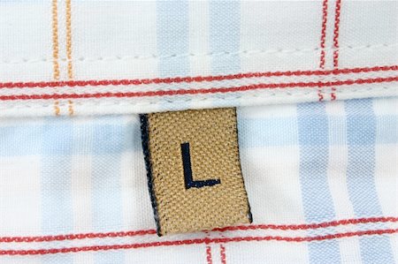 real macro of clothing label - SIZE L Stock Photo - Budget Royalty-Free & Subscription, Code: 400-05060489