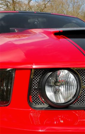 red and black vintage american muscle car close-up Foto de stock - Super Valor sin royalties y Suscripción, Código: 400-05060711