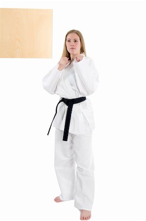 simsearch:400-04558215,k - Black belt female martial artist doing board break. Photographie de stock - Aubaine LD & Abonnement, Code: 400-05061076