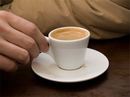 dragunov (artist) - Man's hand with the cup of espresso Stock Photo - Budget Royalty-Free & Subscription, Code: 400-05062240