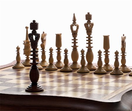simsearch:400-04955785,k - A king chess piece with others in background. White background. Stock Photo - Budget Royalty-Free & Subscription, Code: 400-05062276