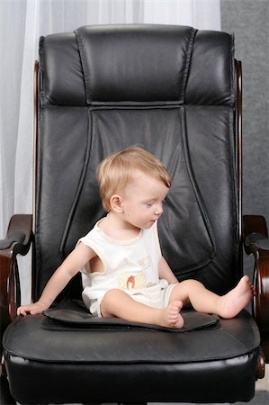 simsearch:400-04093413,k - Very important small kid sits on real boss leather chair Stock Photo - Budget Royalty-Free & Subscription, Code: 400-05062401