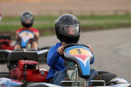 Girl in racing kart with number one Stock Photo - Budget Royalty-Free & Subscription, Code: 400-05062413