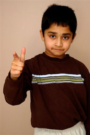 pazham (artist) - A young kid pointing fingers at you Photographie de stock - Aubaine LD & Abonnement, Code: 400-05062597