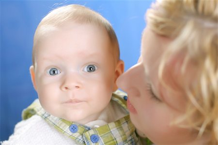 pacifier mom holding - White family - mother takes care about angel like child Stock Photo - Budget Royalty-Free & Subscription, Code: 400-05062707