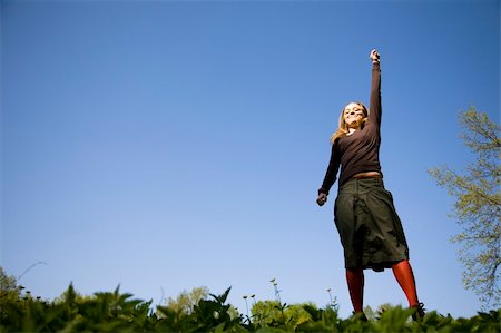 simsearch:400-04215852,k - Jump. Blond Woman Jumping Outdoors. Stock Photo - Budget Royalty-Free & Subscription, Code: 400-05062907