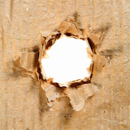 paper torn curl - Hole in Paper. Paper and Cardboard Series. Stock Photo - Budget Royalty-Free & Subscription, Code: 400-05062923