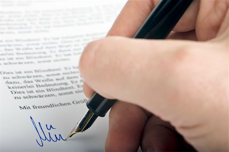 Signing a letter with a fountain pen Stock Photo - Budget Royalty-Free & Subscription, Code: 400-05063405