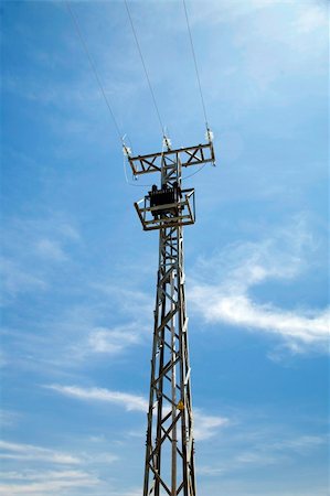 electricity tower with the blue sky behind Stock Photo - Budget Royalty-Free & Subscription, Code: 400-05063880