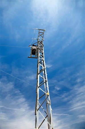 electricity tower with the blue sky behind Stock Photo - Budget Royalty-Free & Subscription, Code: 400-05063881