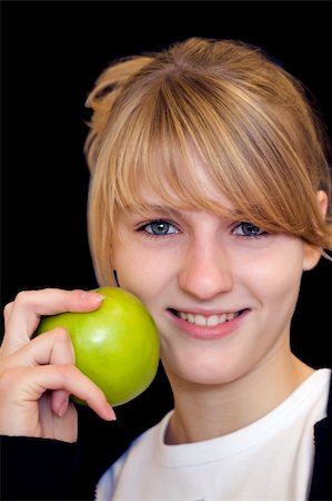 eastern european cuisine - Portrait of girl with green apple Stock Photo - Budget Royalty-Free & Subscription, Code: 400-05074223