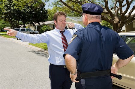 dwi - Police officer giving a roadside sobriety test to a drunk driver. Stock Photo - Budget Royalty-Free & Subscription, Code: 400-05074232