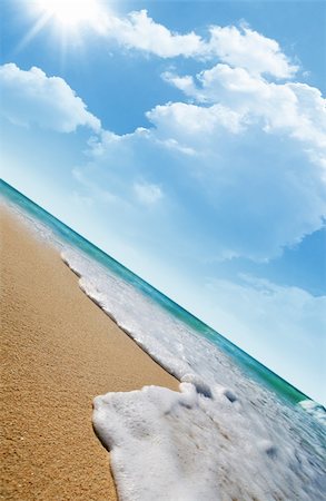 simsearch:400-04874641,k - Sea waves on tropical beach and clouds with sun rays in the background Stock Photo - Budget Royalty-Free & Subscription, Code: 400-05074331