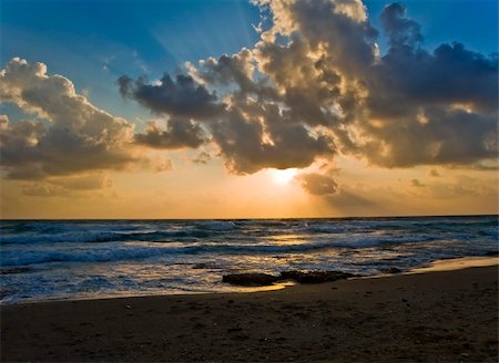 beautiful sunset at the beach Fotografie stock - Microstock e Abbonamento, Codice: 400-05074499