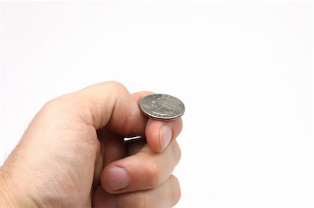 flipping coin - A hand holding a quarter, just about to flip a coin. Stock Photo - Budget Royalty-Free & Subscription, Code: 400-05074627