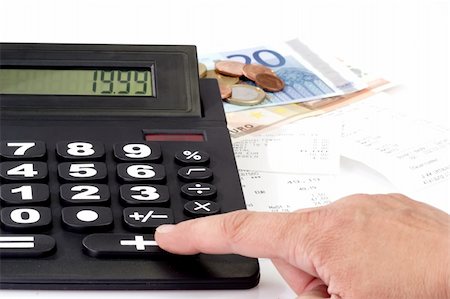 Desk calculator, sales slips and money on bright background Foto de stock - Super Valor sin royalties y Suscripción, Código: 400-05074688