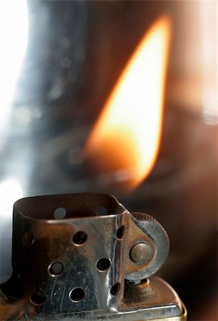 flint - Really great macro photo of a zippo lighter. Sharp close-up and stunning flame. Stock Photo - Budget Royalty-Free & Subscription, Code: 400-05074963