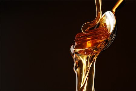 Honey flowing out of the spoon stock photo Photographie de stock - Aubaine LD & Abonnement, Code: 400-05075350