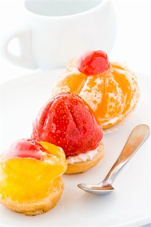 Three beautiful small cakes are decorated by fruit Stock Photo - Budget Royalty-Free & Subscription, Code: 400-05076515