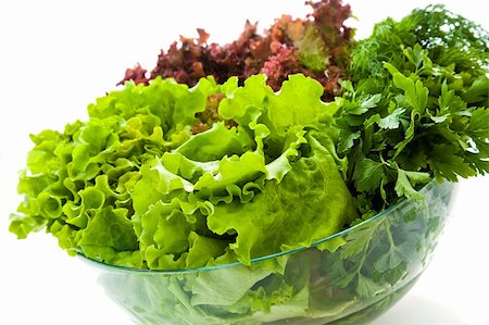 simsearch:400-05369257,k - Some bunches of fresh salads in a glass bowl Photographie de stock - Aubaine LD & Abonnement, Code: 400-05076520