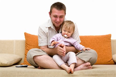 happy family sitting on sofa Photographie de stock - Aubaine LD & Abonnement, Code: 400-05077012