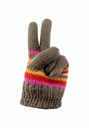snow cosy - bright knitted gloves with peace sign. Isolated Stock Photo - Budget Royalty-Free & Subscription, Code: 400-05077196
