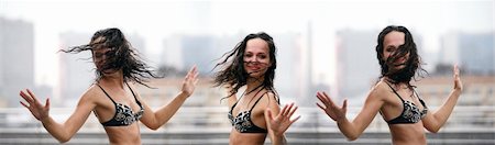person falling in the wind - The beautiful woman dances on a roof under a rain Stock Photo - Budget Royalty-Free & Subscription, Code: 400-05077221