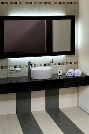 Luxury bathroom with modern basin and big mirror Stock Photo - Budget Royalty-Free & Subscription, Code: 400-05077306