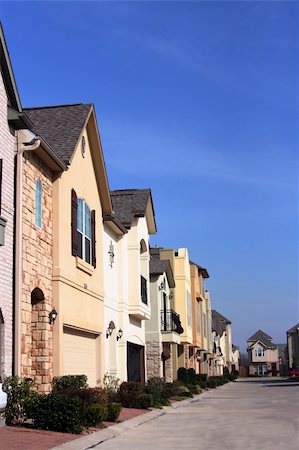 family with sold sign - An urban neighborhood where the homes are close together Stock Photo - Budget Royalty-Free & Subscription, Code: 400-05077469