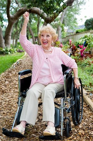 Disabled senior lady in pink, excited about achieving her health goals. Stock Photo - Budget Royalty-Free & Subscription, Code: 400-05077659