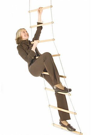 An isolated photo of a businesswoman climbing a rope-ladder Stock Photo - Budget Royalty-Free & Subscription, Code: 400-05077652