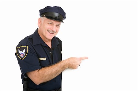 Happy policeman pointing at blank white space.  Isolated design element. Photographie de stock - Aubaine LD & Abonnement, Code: 400-05077660