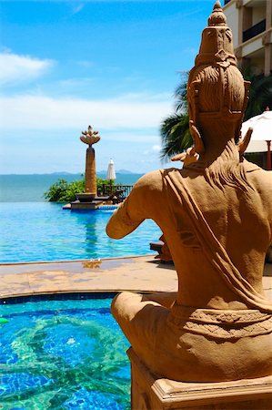 simsearch:400-05154191,k - Sculpture of praying Buddha near the poolside Stock Photo - Budget Royalty-Free & Subscription, Code: 400-05077744