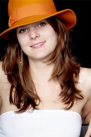 simsearch:400-04996782,k - smily young woman with long brown hair and orange hat Foto de stock - Super Valor sin royalties y Suscripción, Código: 400-05077777