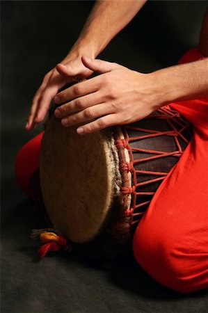 Man playing the nigerian drum in studio Stock Photo - Budget Royalty-Free & Subscription, Code: 400-05078069