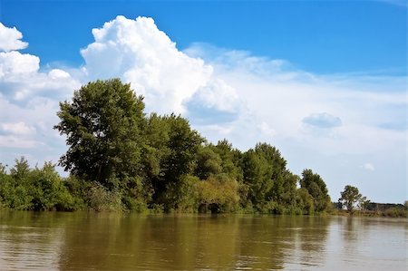 selhin (artist) - Hot summer day. On the bank of the river - the trees. A blue sky. Travel and Recreation summer in nature is very useful for health. Photographie de stock - Aubaine LD & Abonnement, Code: 400-05078317