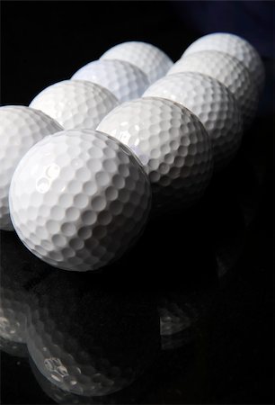 many golf balls on the black background Stock Photo - Budget Royalty-Free & Subscription, Code: 400-05078667