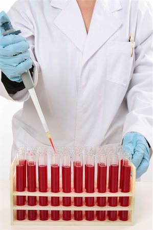 Scientist or other laboratory worker using a 90µL fixed volume pipette to extract samples from test tubes. Stock Photo - Budget Royalty-Free & Subscription, Code: 400-05078752