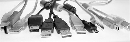 simsearch:400-05078674,k - USB cables with plugs lay in a number(line), wires are chaotically bound Fotografie stock - Microstock e Abbonamento, Codice: 400-05078767