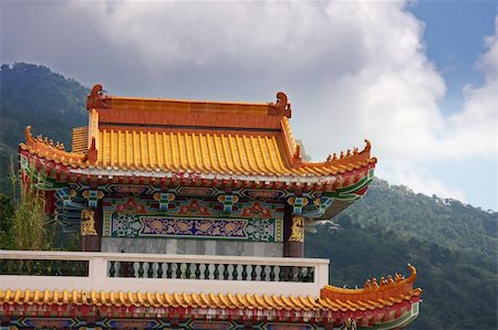 rain on roof - Traditional chinese buddhist temple against dark storm clouds Stock Photo - Budget Royalty-Free & Subscription, Code: 400-05078880