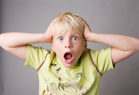 simsearch:400-04382028,k - Portrait of a young boy shouting madly Photographie de stock - Aubaine LD & Abonnement, Code: 400-05079270