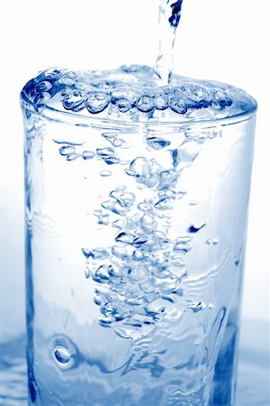 simsearch:400-08815499,k - Big long drop of cold water poured into full glass (isolated on white background) Foto de stock - Royalty-Free Super Valor e Assinatura, Número: 400-05079272