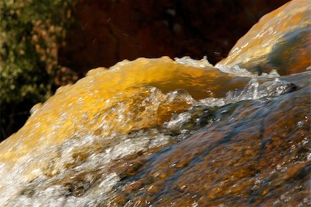 simsearch:400-03909565,k - Close-up of flowing water of a mountain stream Stockbilder - Microstock & Abonnement, Bildnummer: 400-05079749