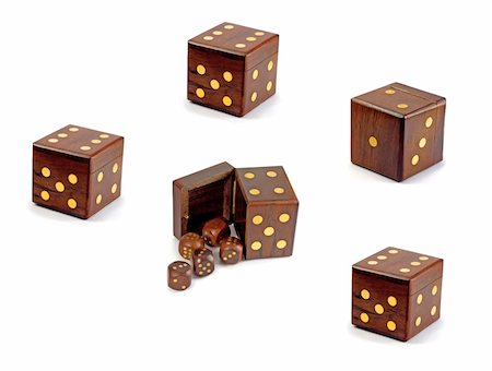 dado - wooden playing dices in dice over white background Stock Photo - Budget Royalty-Free & Subscription, Code: 400-05070551