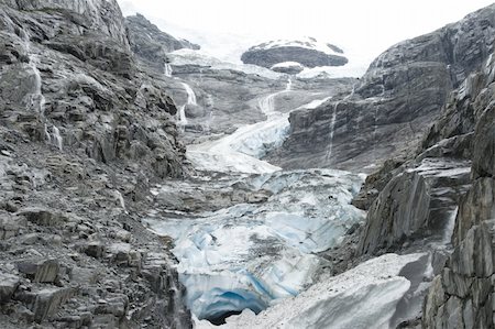 simsearch:400-05383454,k - Glacier in Norway is among the rocks Foto de stock - Royalty-Free Super Valor e Assinatura, Número: 400-05070619