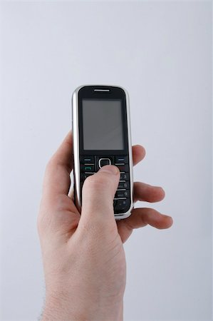 simsearch:400-04412834,k - Hand and black telephone Stock Photo - Budget Royalty-Free & Subscription, Code: 400-05070649