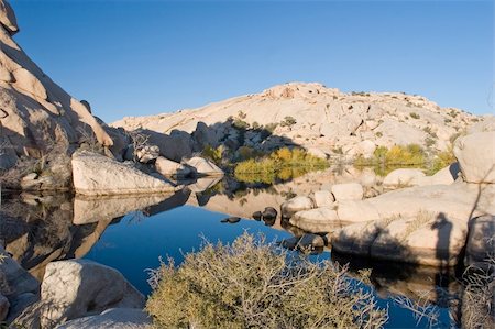 Barker Dam is a water-storage facility located in Joshua Tree National Park in California. The dam was constructed by early cattlemen, and is situated between Queen Valley and the Wonderland of Rocks near the Wall Street Mill. Stock Photo - Budget Royalty-Free & Subscription, Code: 400-05070829