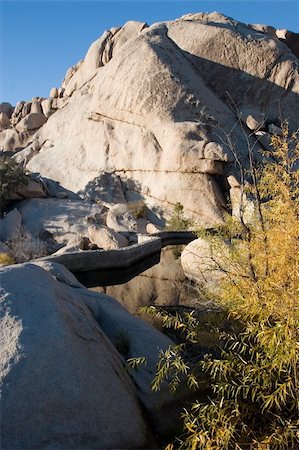 simsearch:400-04066006,k - Barker Dam is a water-storage facility located in Joshua Tree National Park in California. The dam was constructed by early cattlemen, and is situated between Queen Valley and the Wonderland of Rocks near the Wall Street Mill. Fotografie stock - Microstock e Abbonamento, Codice: 400-05070830